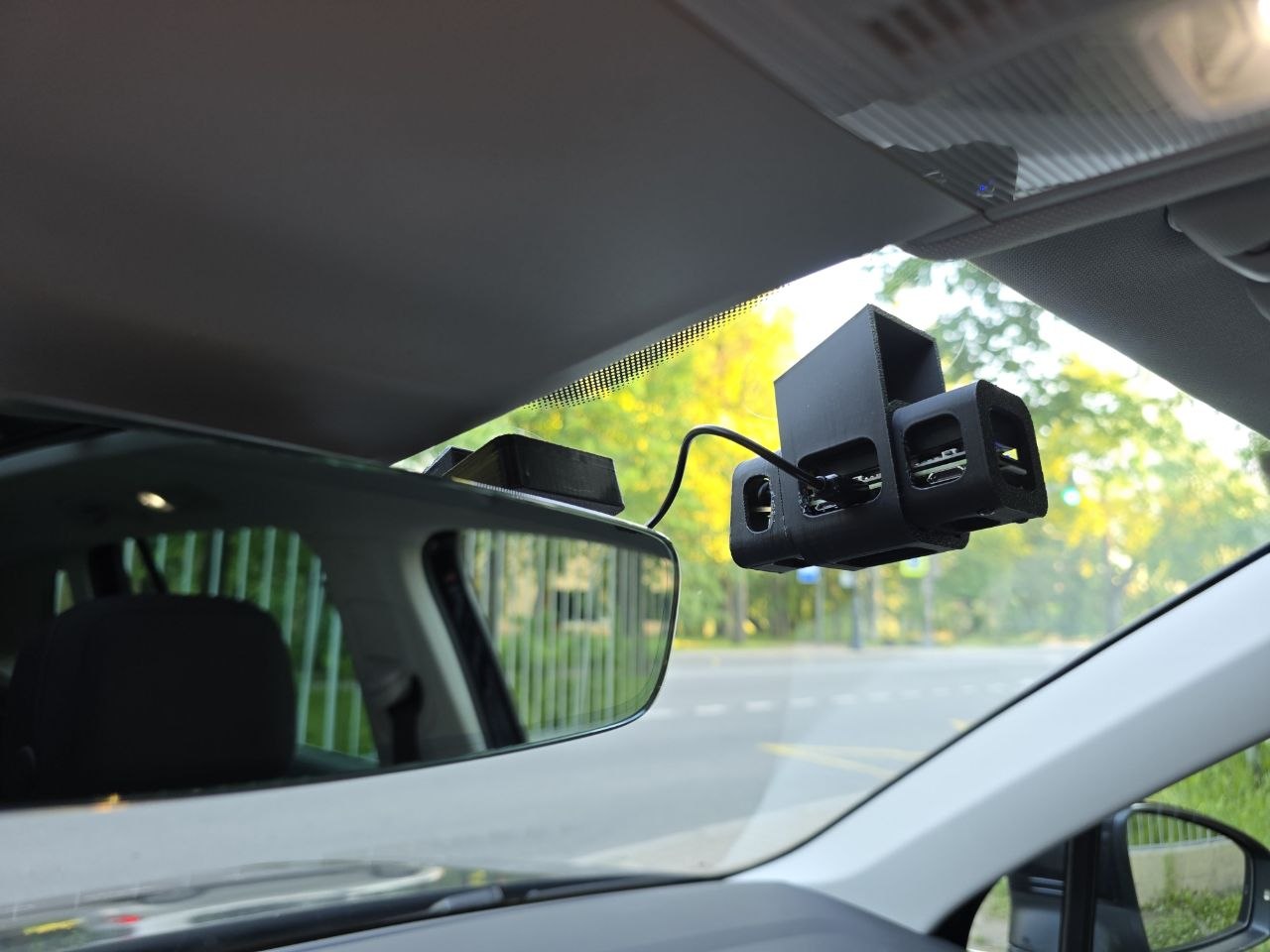 Mounted at the rear-view mirror